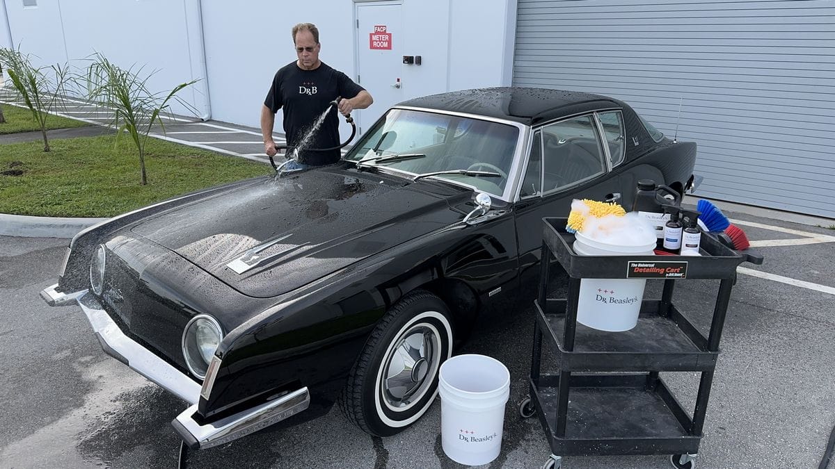 Rinsing black car