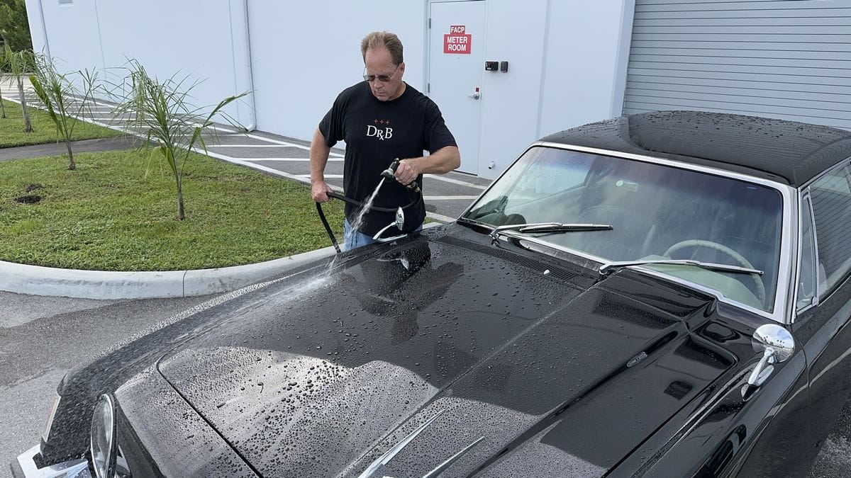 Rinsing black car