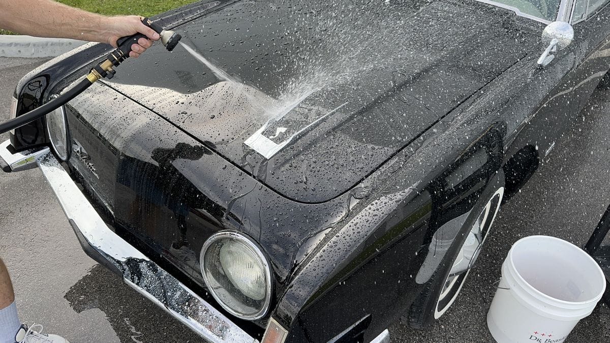 Rinsing black car