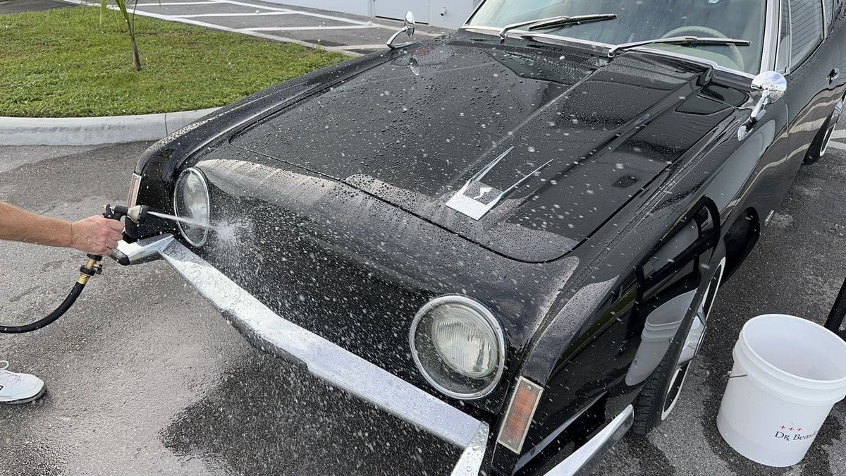 Rinsing black car