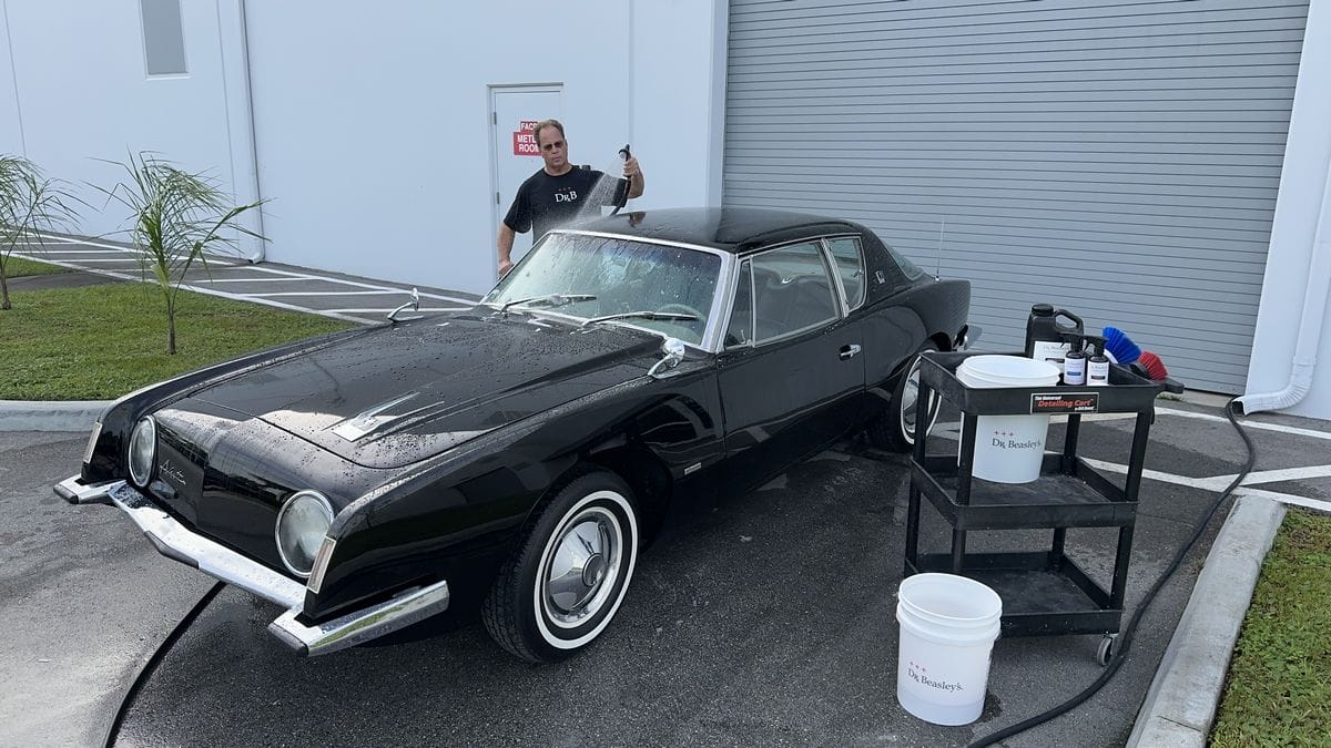 Rinsing black car