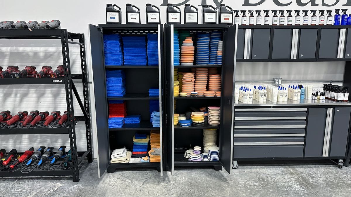Storage cabinets filled with polishing pads and towels
