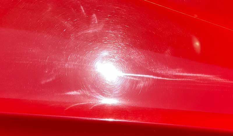 Swirls and holograms on red single stage paint