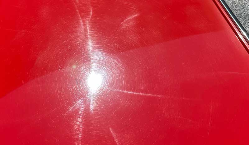 Swirls and holograms on red single stage paint