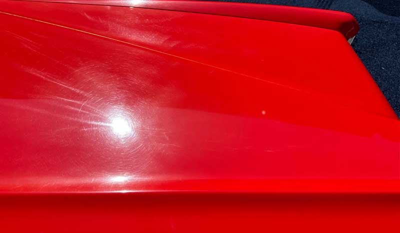 Swirls and holograms on red single stage paint