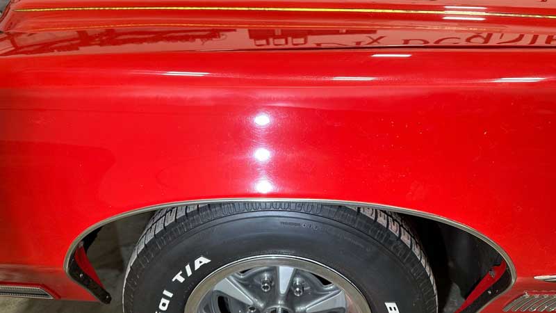 Swirls and holograms on red single stage paint