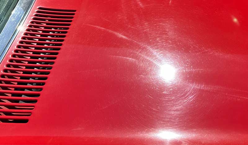 Swirls and holograms on red single stage paint