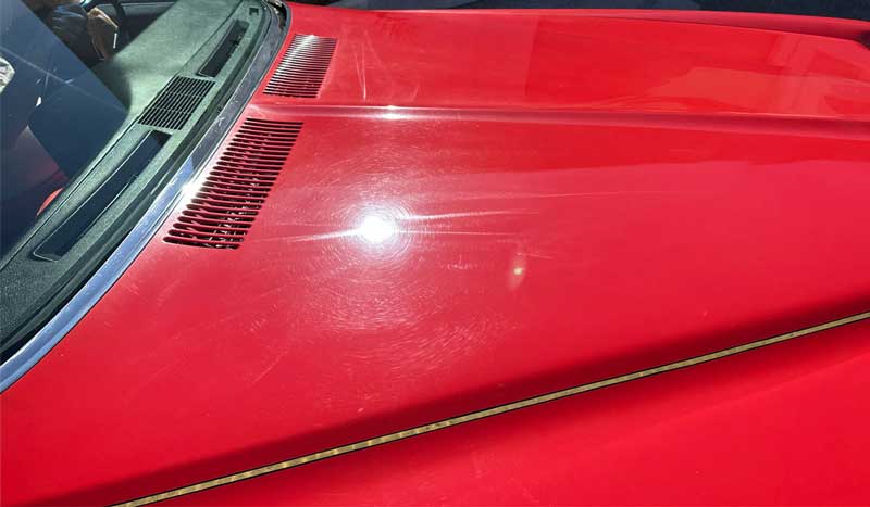 Swirls and holograms on red single stage paint