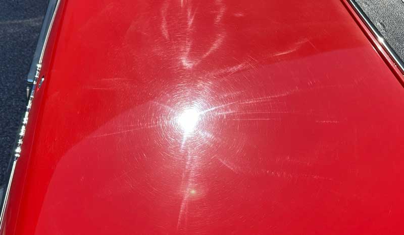 Swirls and holograms on red single stage paint
