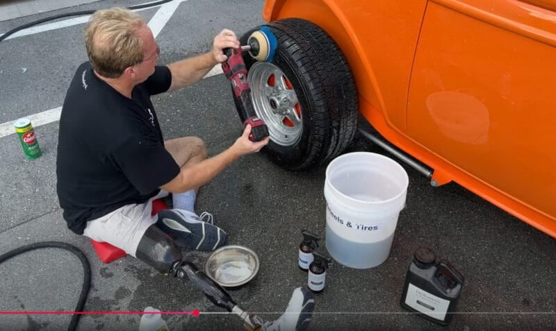Mike Phillips polishing car wheel with power buffer