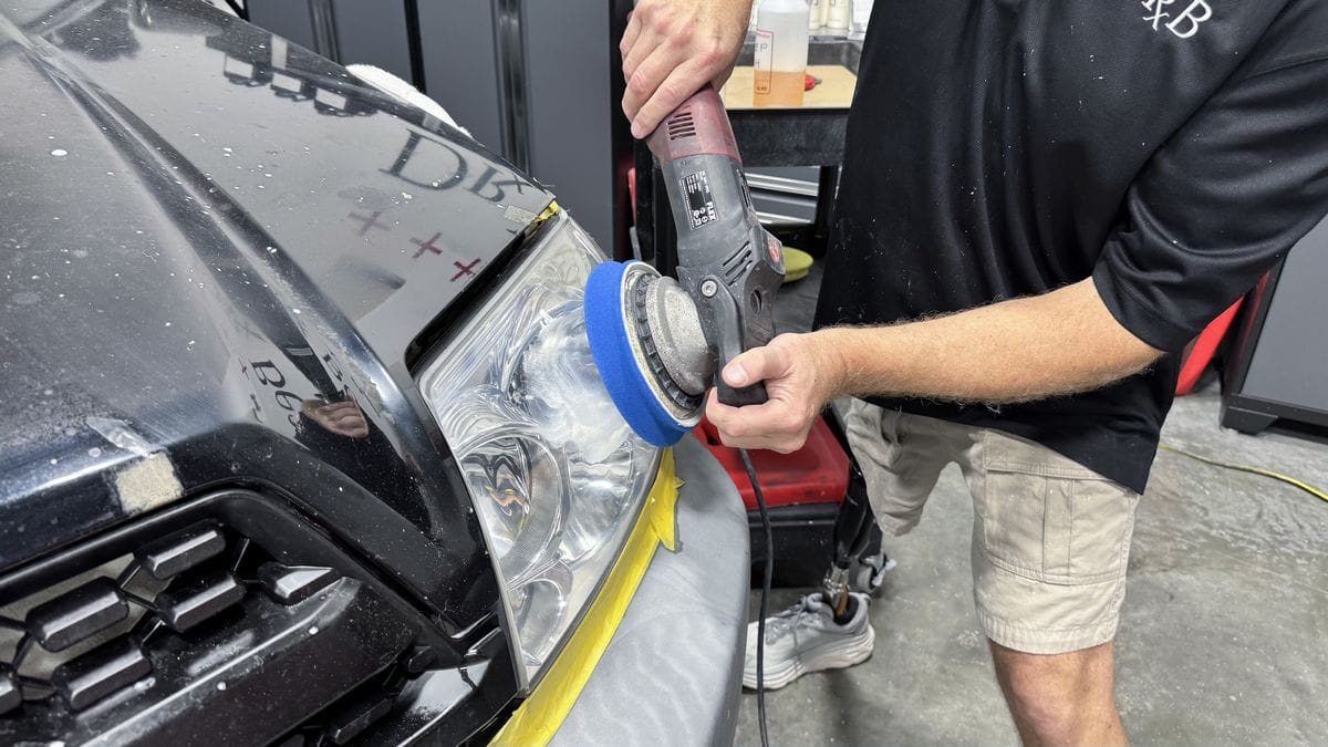 Polishing headlights with foam pad on orbital polisher