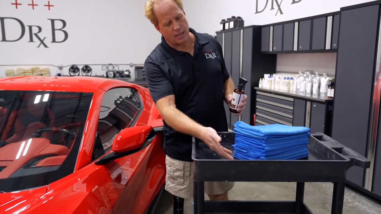 Mike Phillips pointing to a stack of microfiber towels