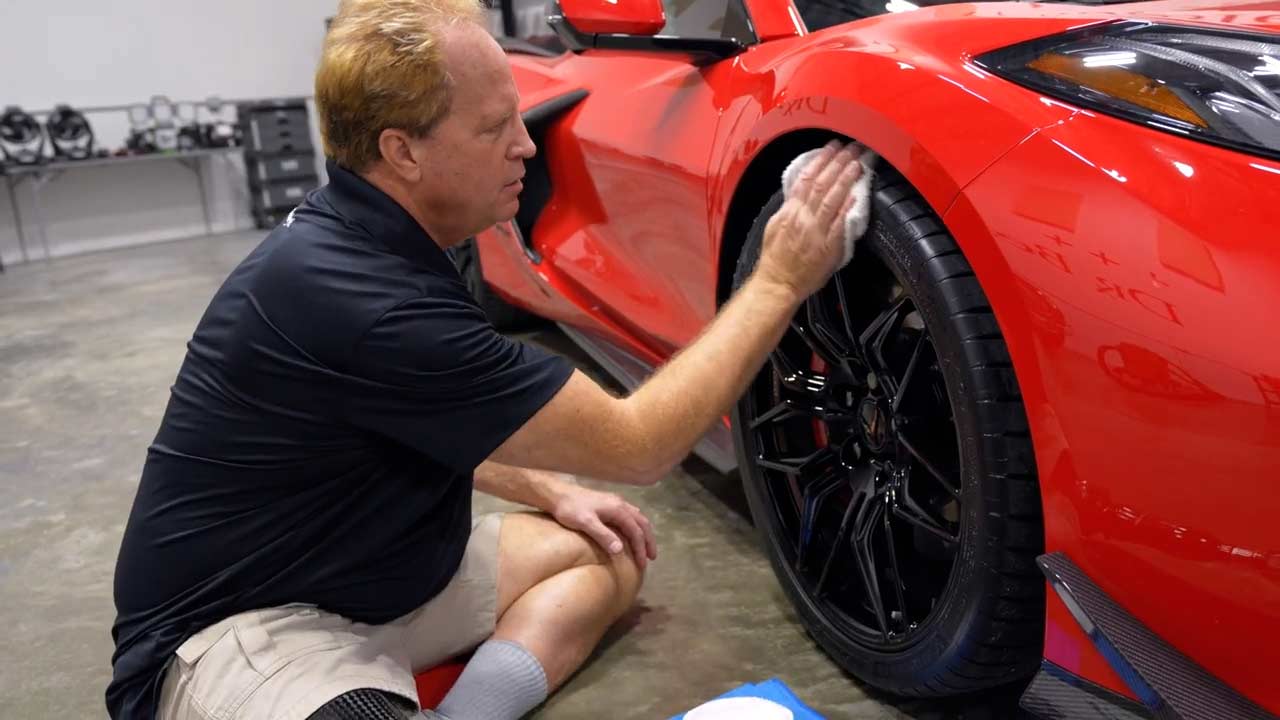 Removing excess tire dressing from Corvette tire