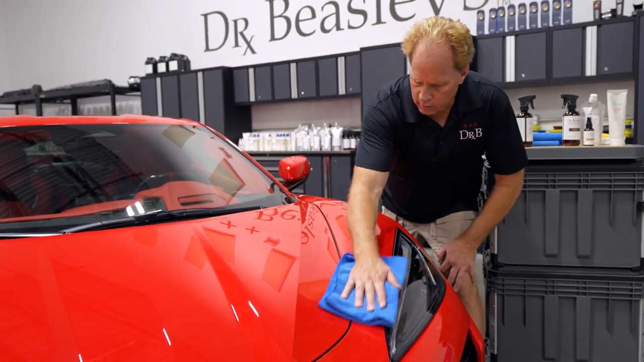Wiping Dr. Beasley's Bead Hero ceramic spray on Corvette