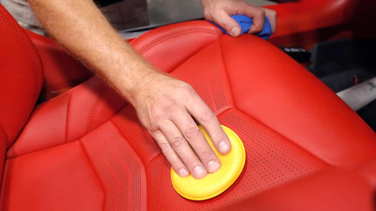 Applying leather conditioner to perforated seats