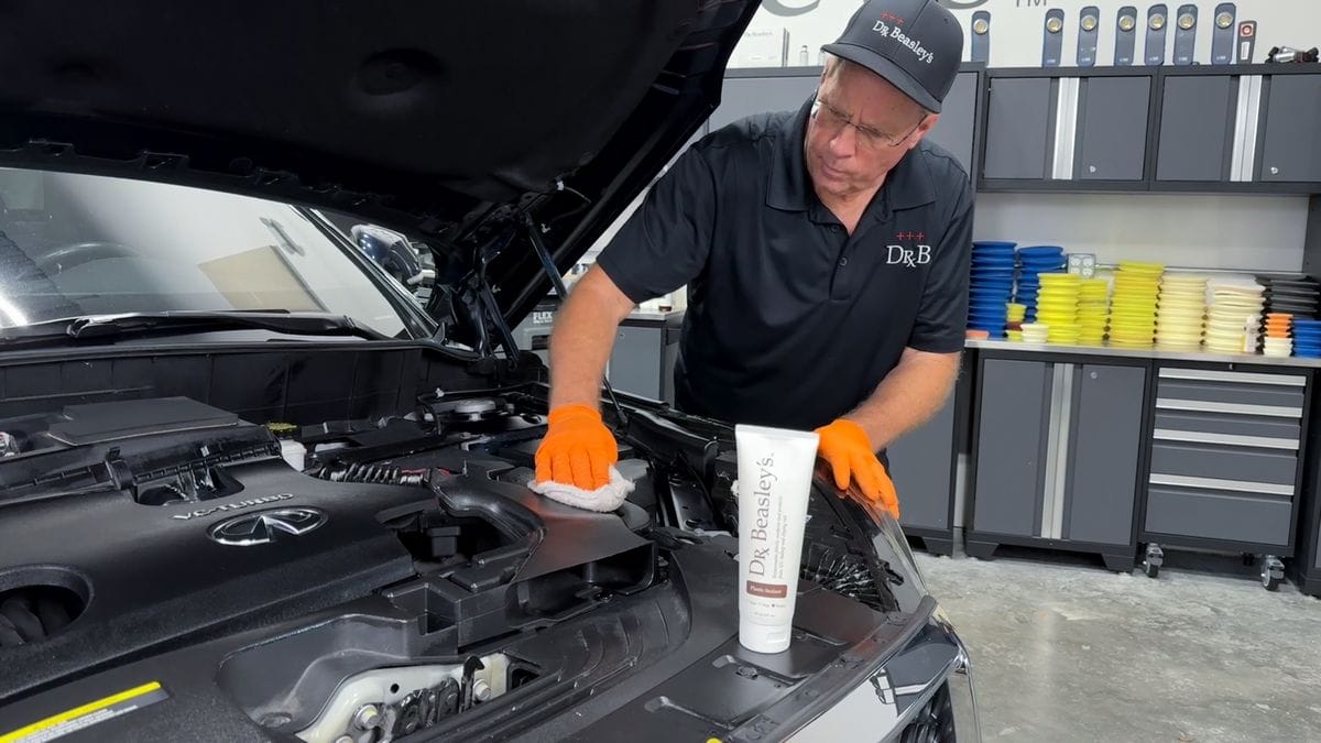 Applying sealant for plastic to engine compartment