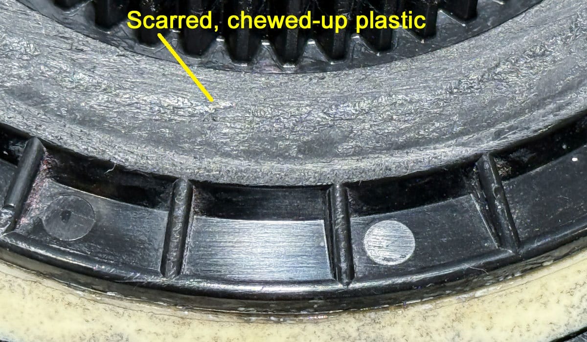 Scarred plastic inside backing plate after tool malfunction