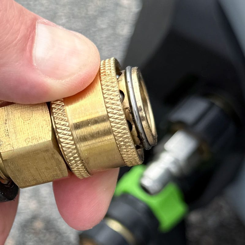 Pressure washer spring loaded collar