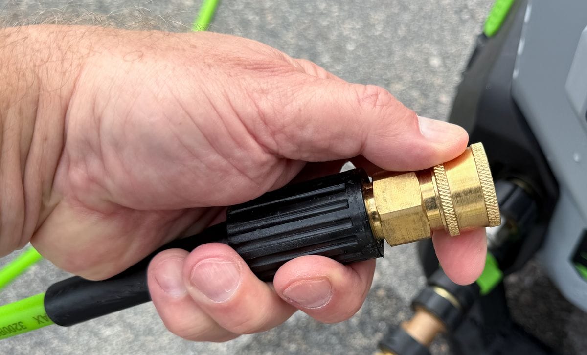 Pressure washer spring loaded collar