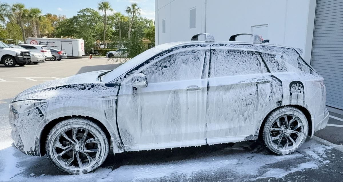 Car covered in foam from foam cannon