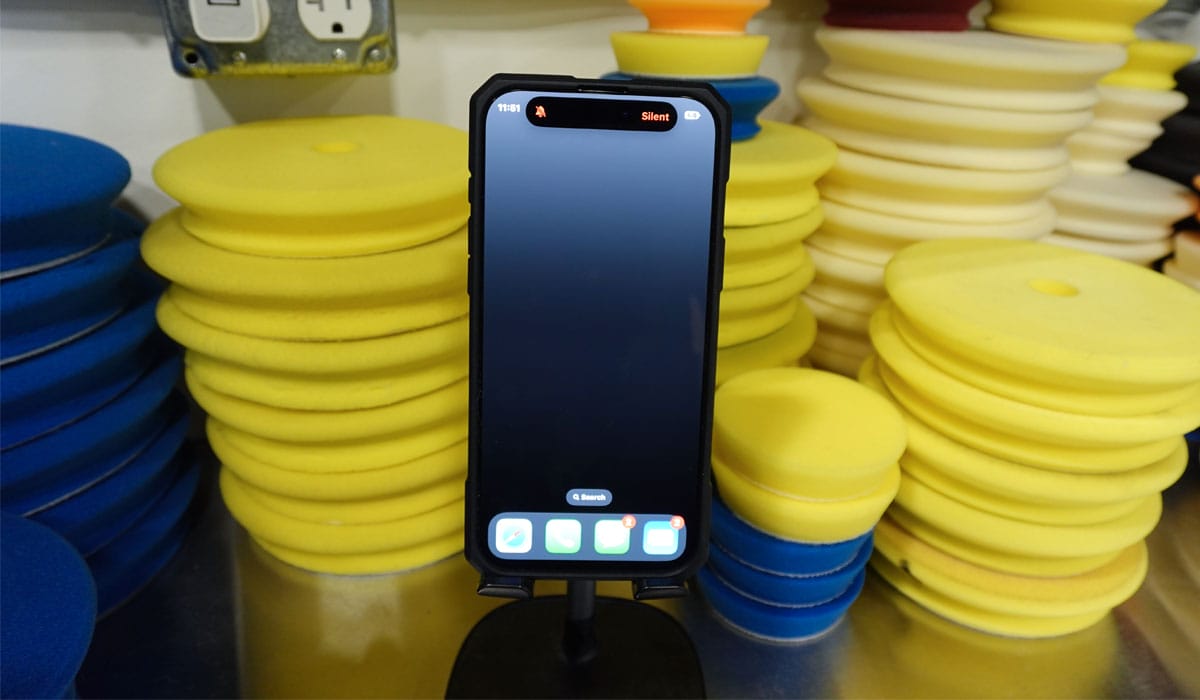 Putting phone away while polishing car