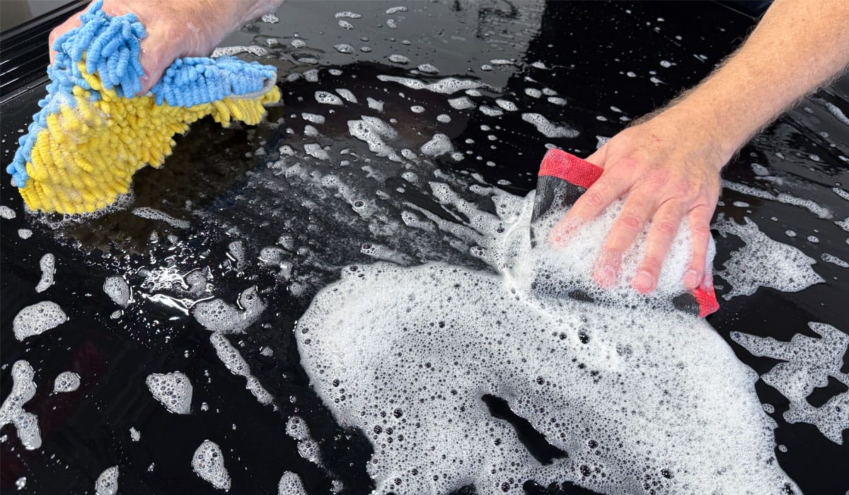 Decontaminating paint during wash process