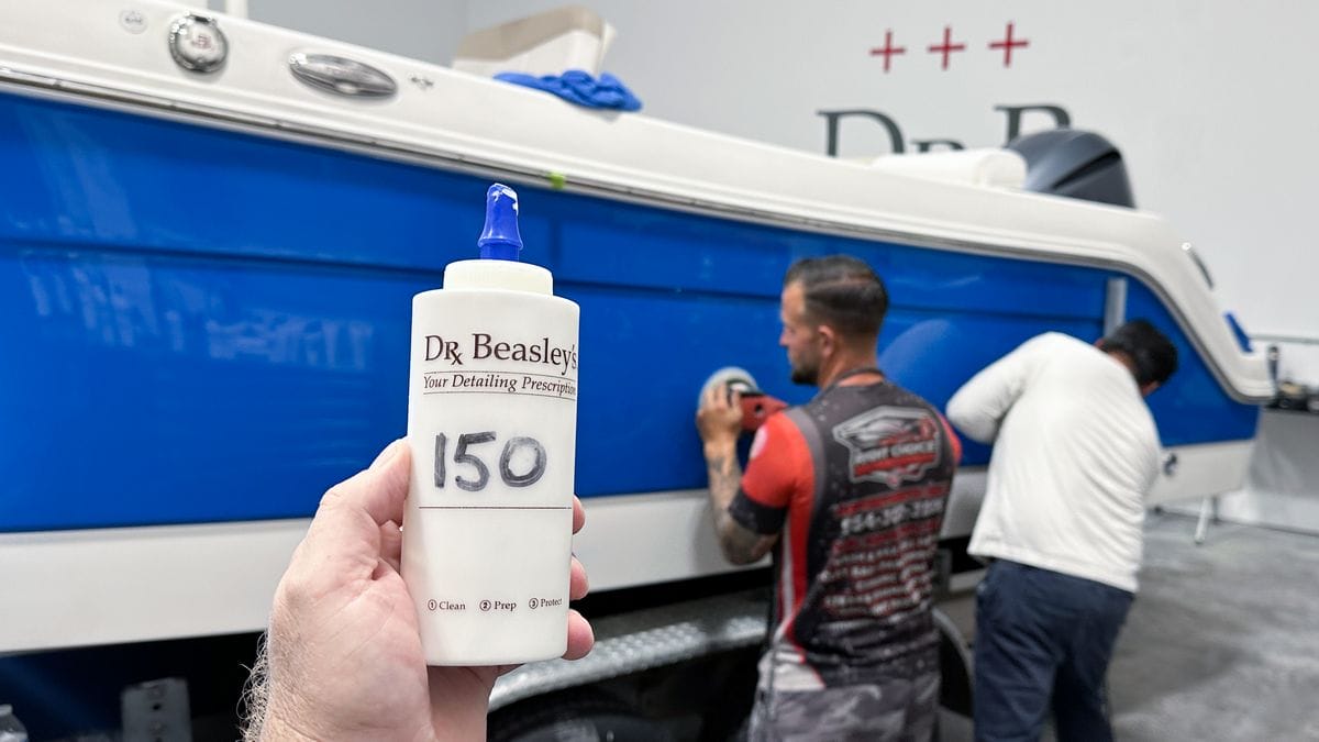 Dr. Beasley's NSP 150 in front of boat being polished