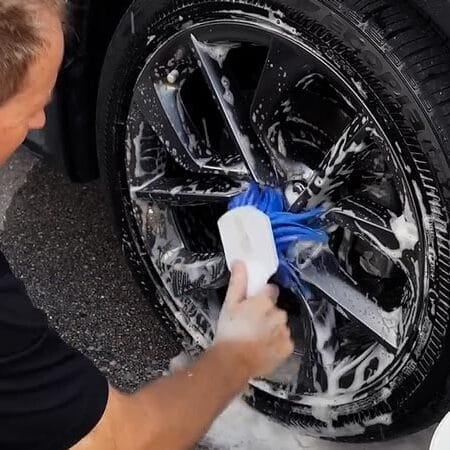 Cleaning clear coat wheels with a flagged tip wheel brush