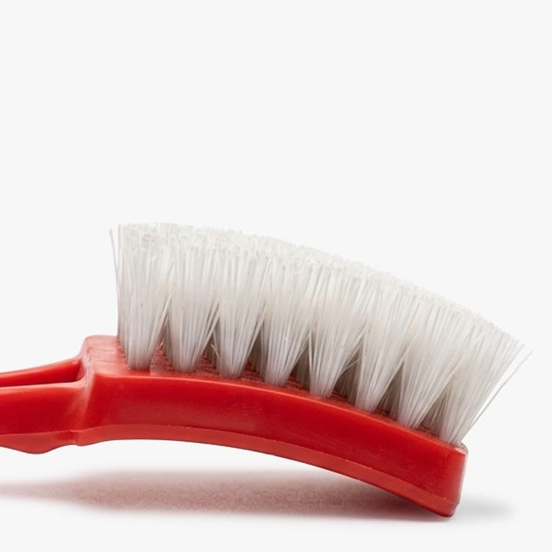 Close-up of a tire cleaning brush