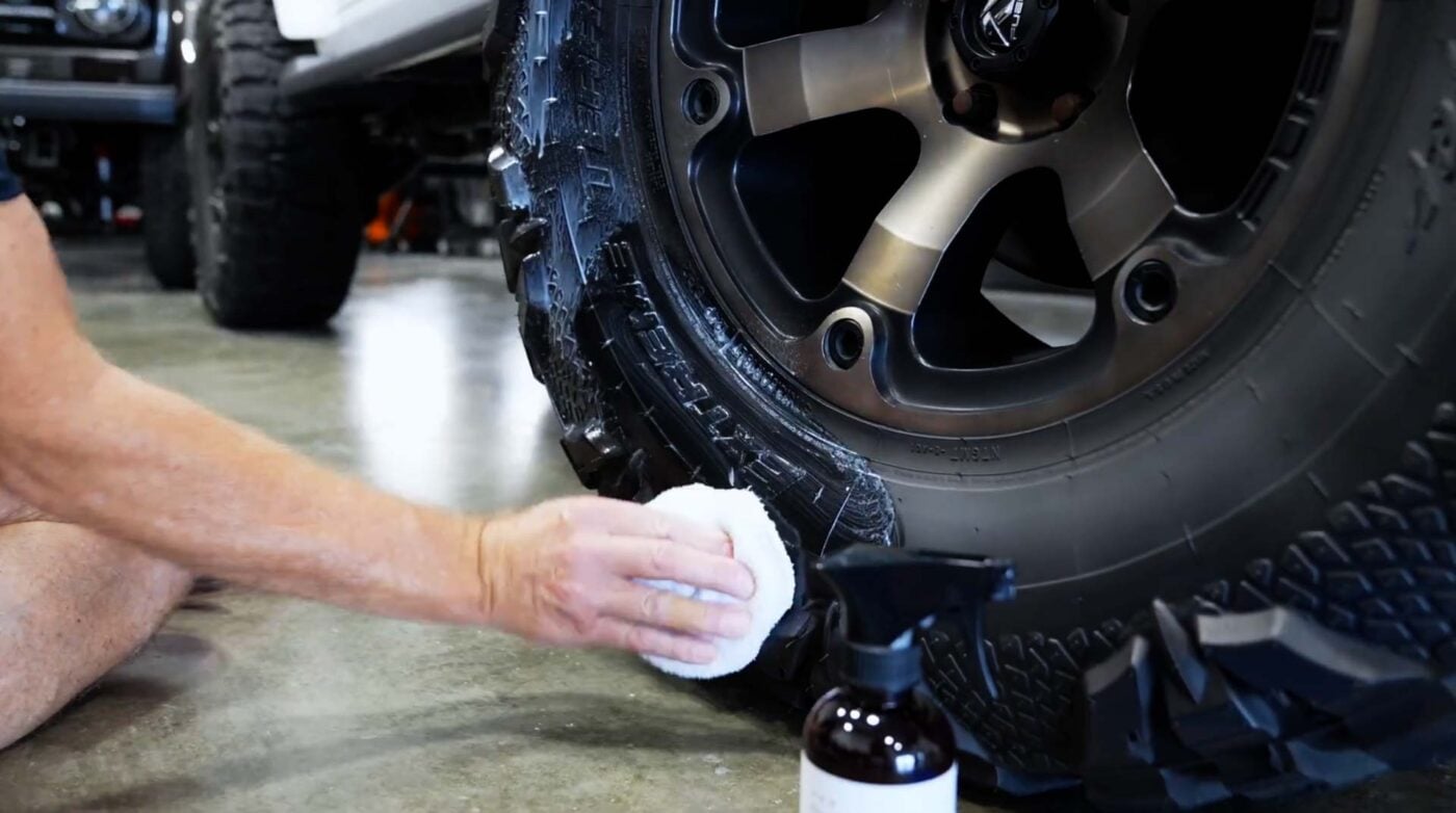 r. Beasley's Trim & Tire Coating Kit tire dressing being applied to a tire — complete coating system for long-lasting tire conditioner protection