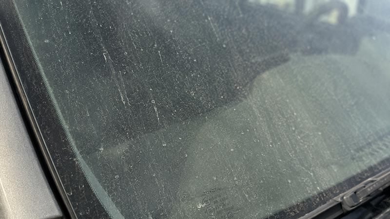 Traffic film bonded to glass