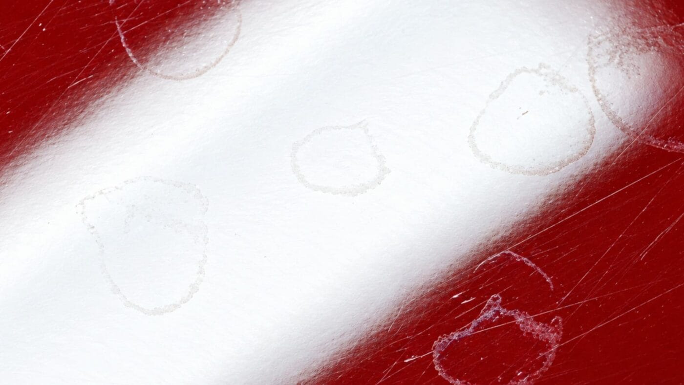 Water spots and mineral deposits on car paint after summer