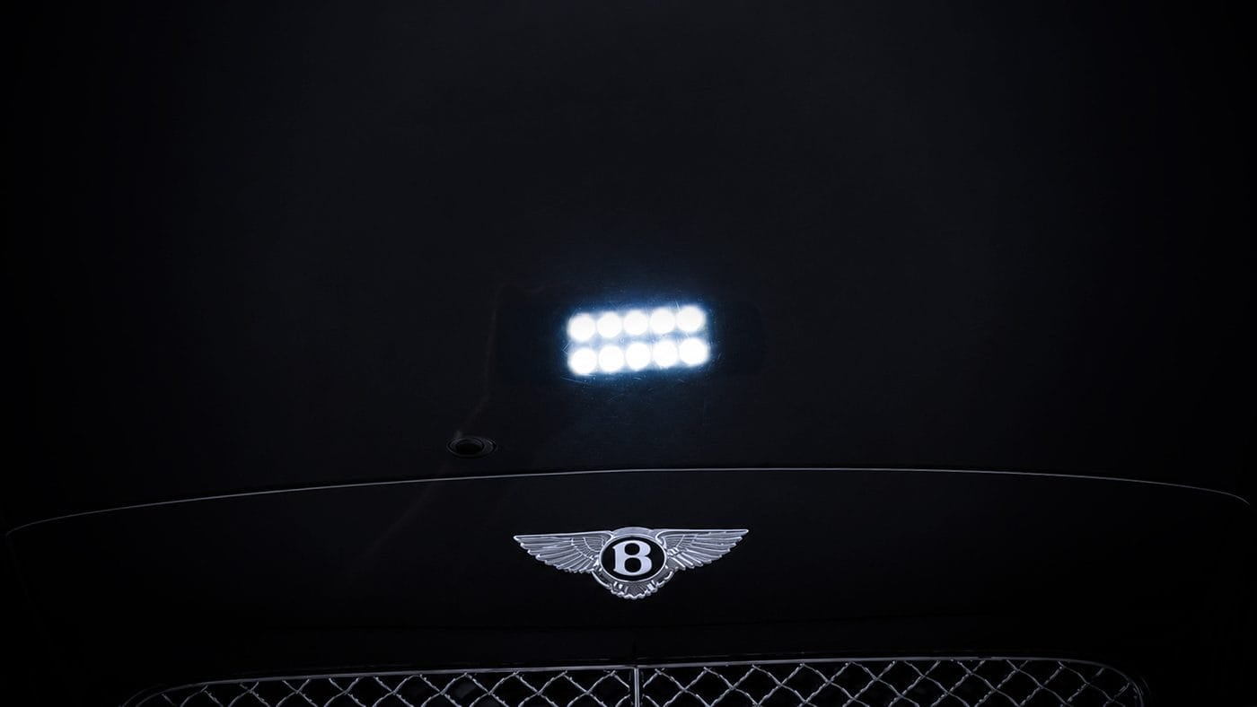 Restored gloss car paint on Bentley after polishing and paint correction